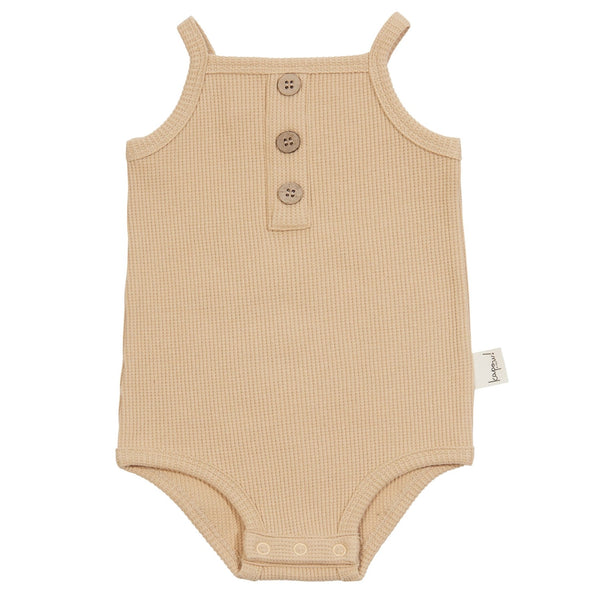 Snuggle into this soft Sand Waffle Singlet Bodysuit and be as cozy as a beachside coconut. With its fitted style, non-functional coconut buttons, and snaps at the crotch for easy nappy changes, you'll have all the comfort and convenience you need!   KaPow Kids is designed in Melbourne and manufactured slowly and ethically in China.
